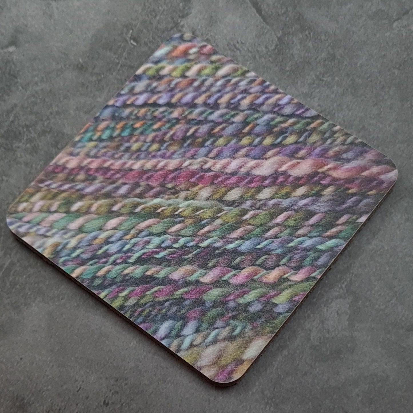Coaster printed with images of handspun yarn and cork backing