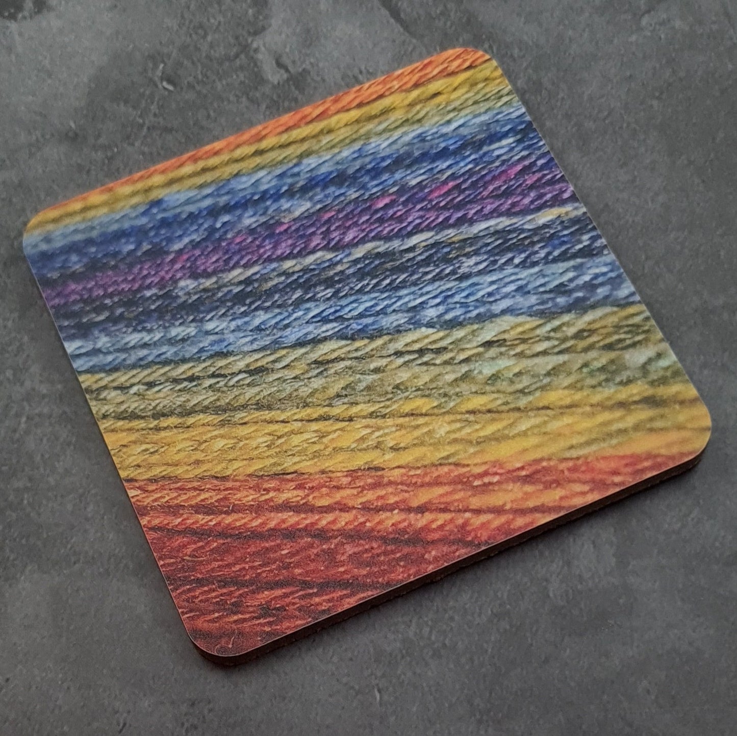 Coaster printed with images of handspun yarn and cork backing