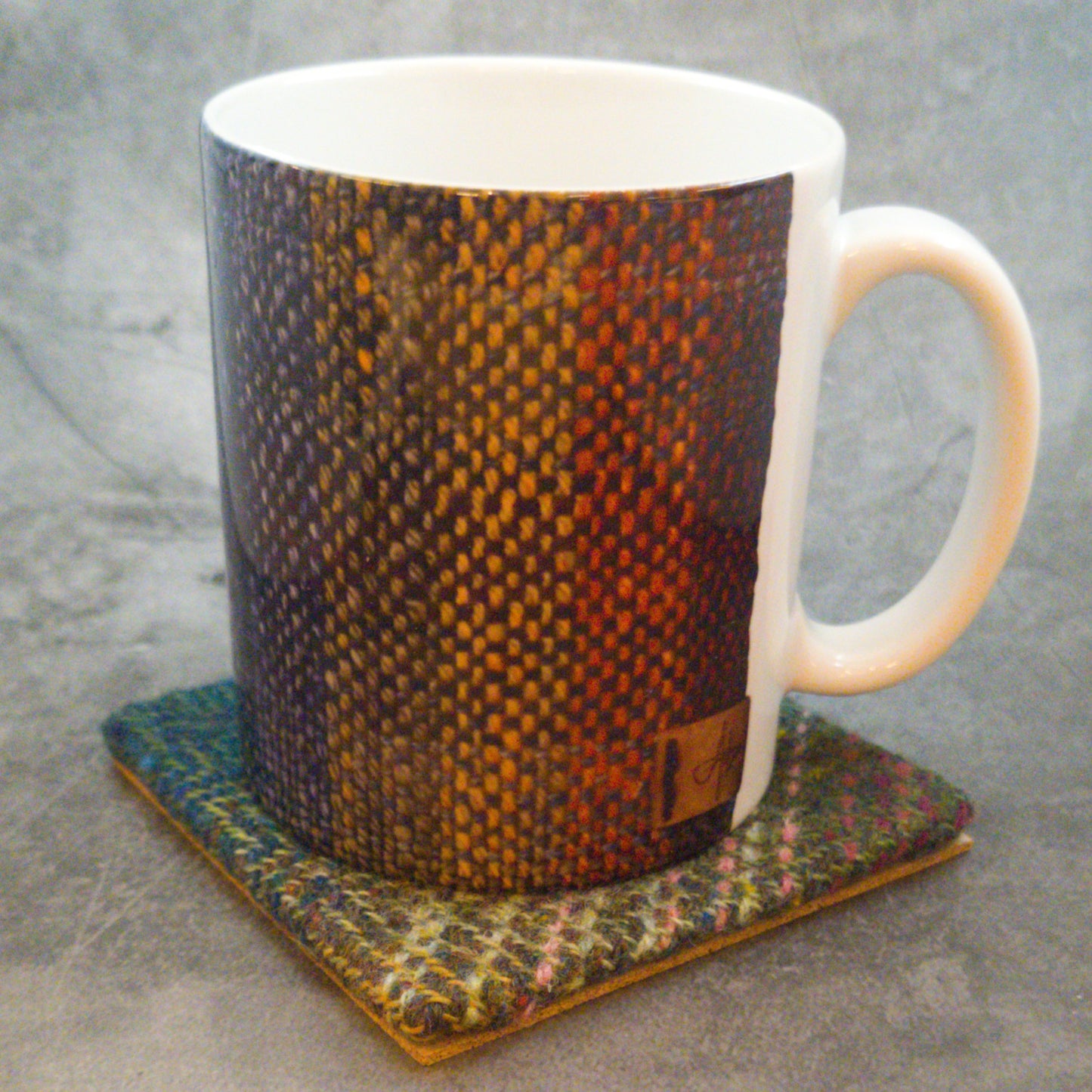 Coaster featuring handwoven fabric and Cork backing - Charcoal & Orange