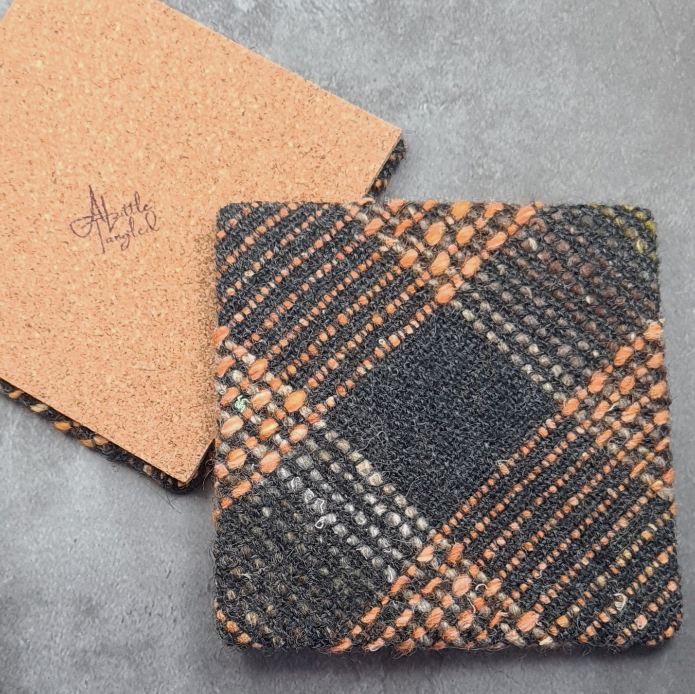 Coaster featuring handwoven fabric and Cork backing - Charcoal & Orange
