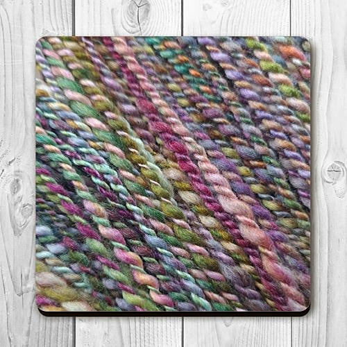 Coaster printed with images of handspun yarn and cork backing